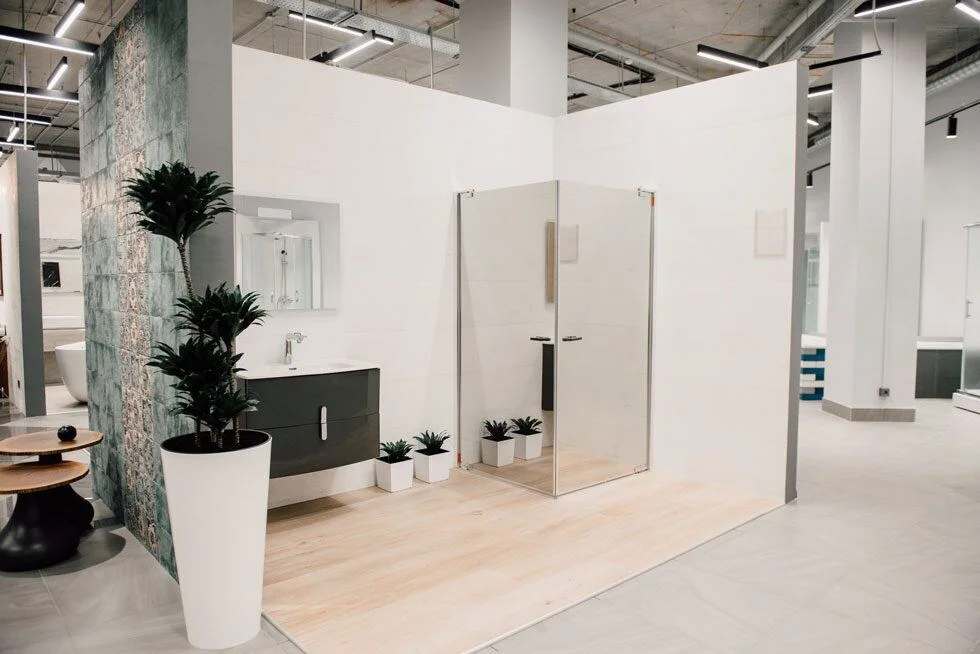 Agromat showroom: bathroom displays and circulation between product settings. Retained project photograph.