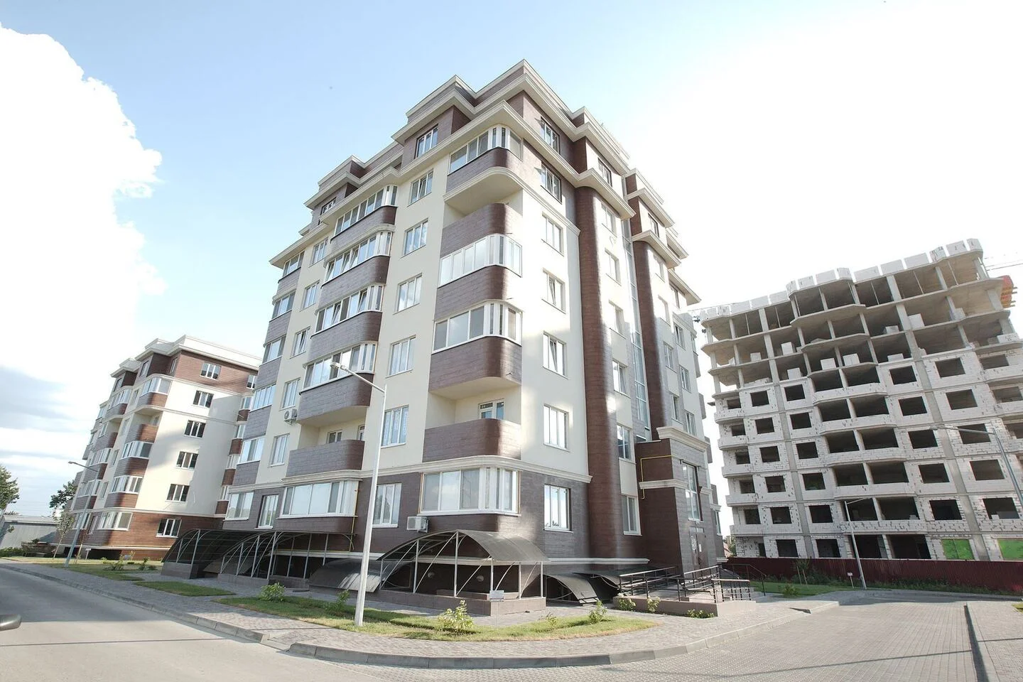 Golden Era: completed façade packages beside a building still under construction. FES project photograph.