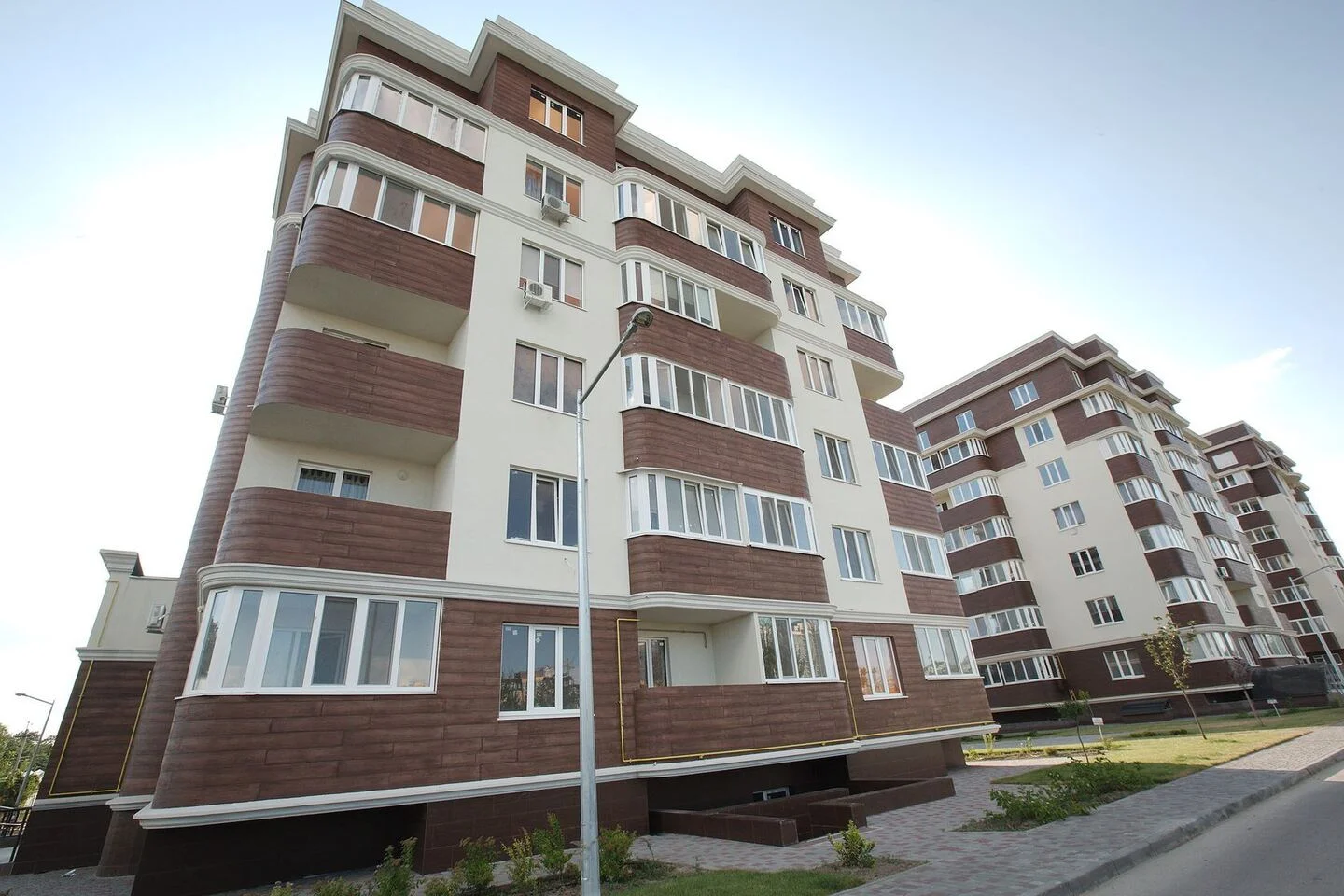 Golden Era: glazing and façade finishes around the residential courtyard. FES project photograph.