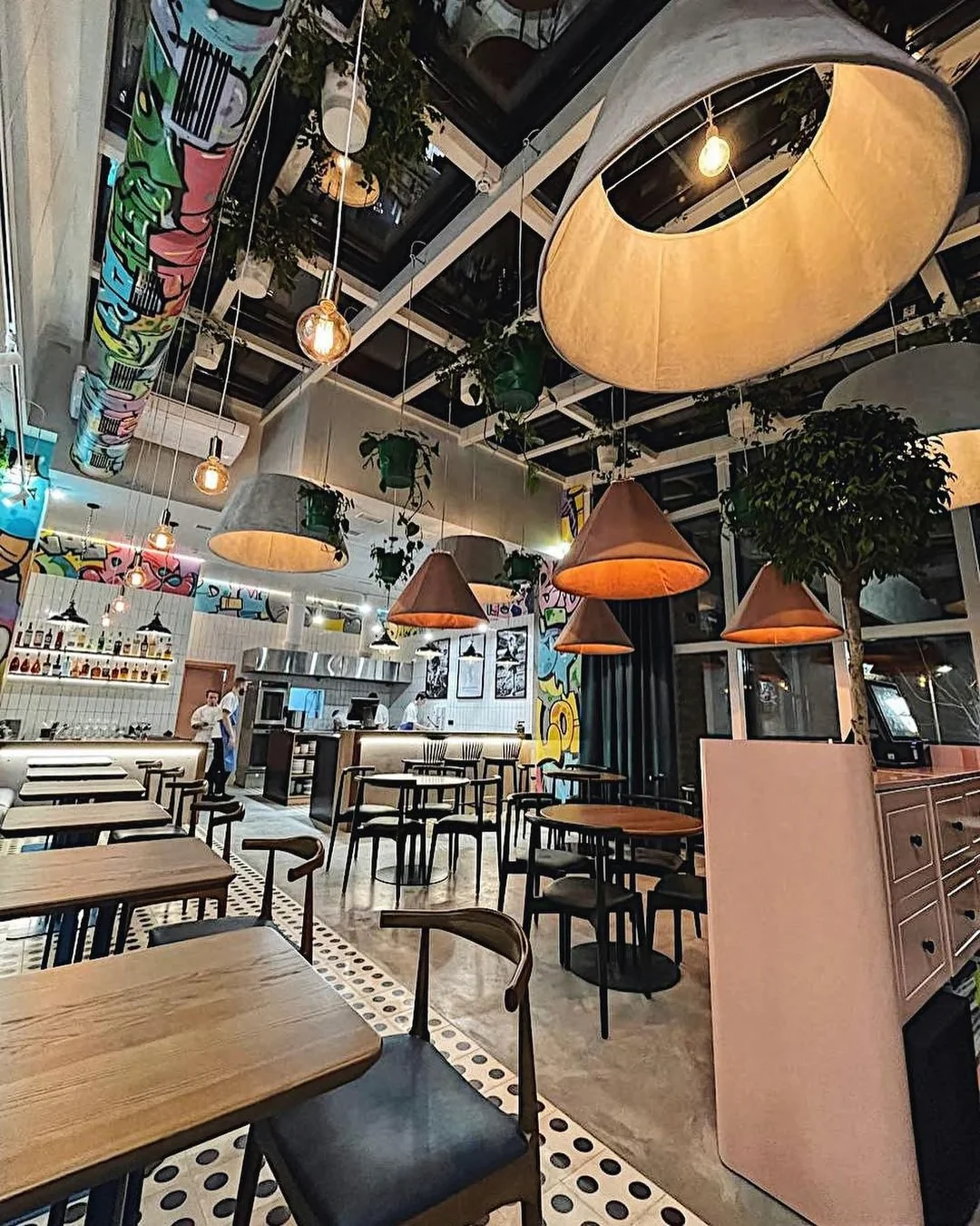 Yourz Bistro: the dining room, open ceiling and hanging lights. Completed-interior photograph.