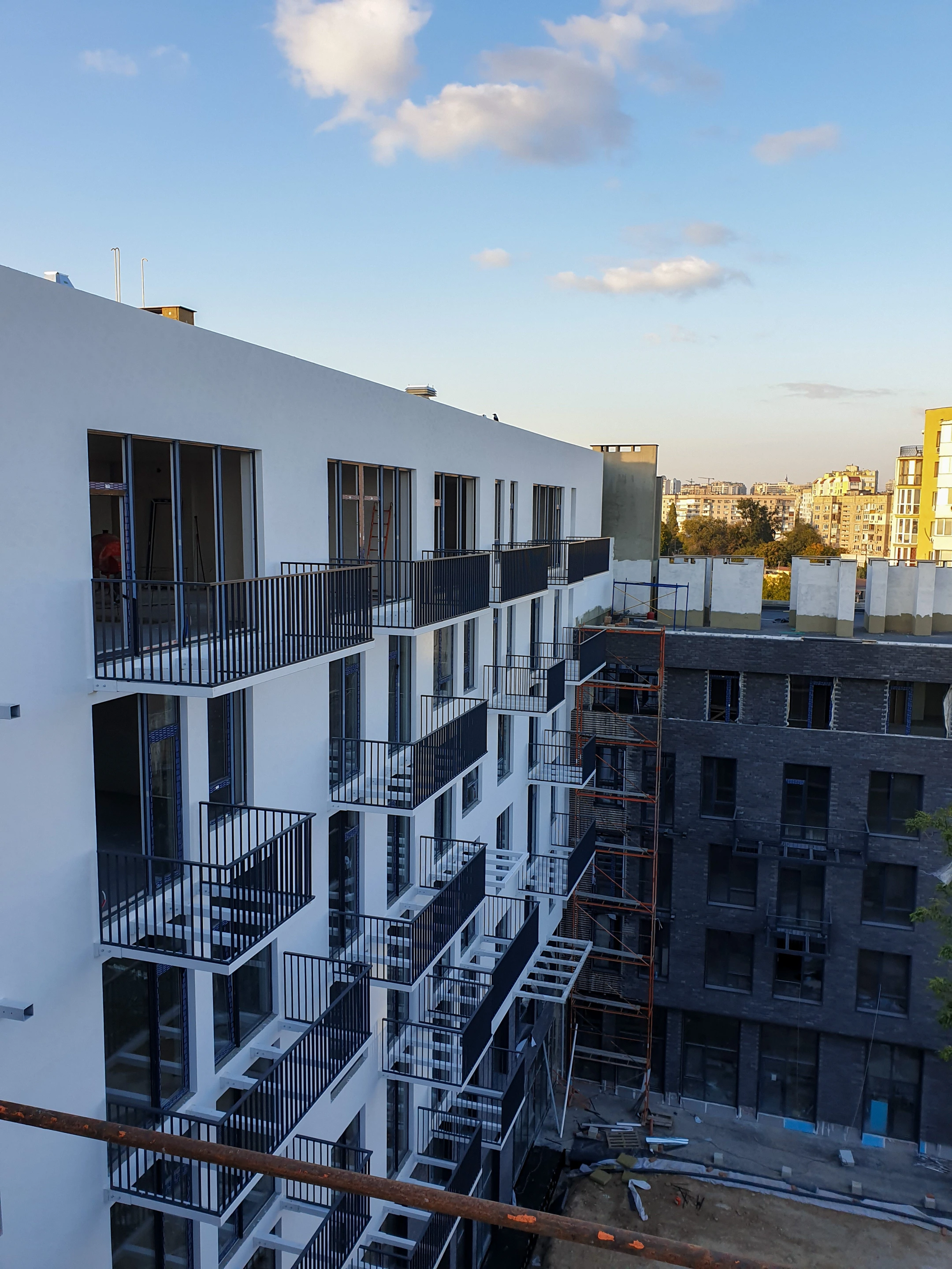 9th Fontana residential project — façade and courtyard during construction. Project archive photograph.