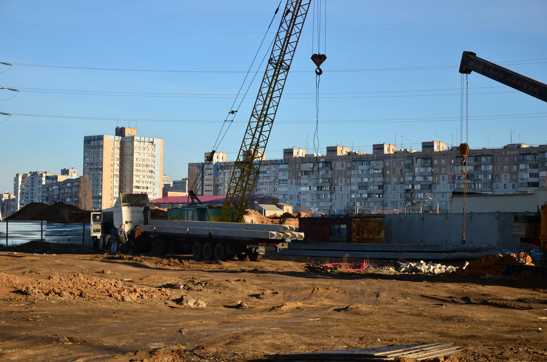 Phased residential site: crane and site logistics beside the developing buildings. Owner-identified archive, 20 December 2013.