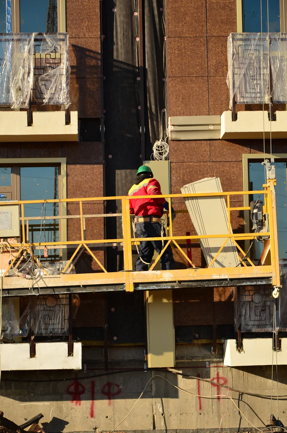 Phased residential site: workers on an external access platform. Owner-identified archive, 20 December 2013.